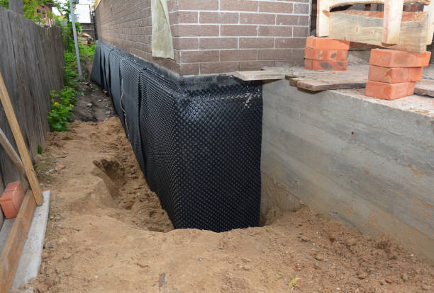 Happy homeowners after waterproofing job in Medaryville